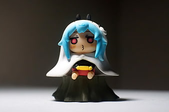 Cute Blue-Haired Anime Character Figurine on Dark Background