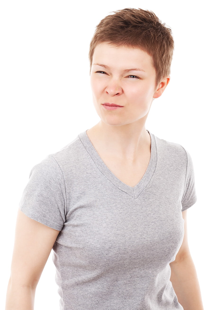 Young woman with short hair making a disgusted face