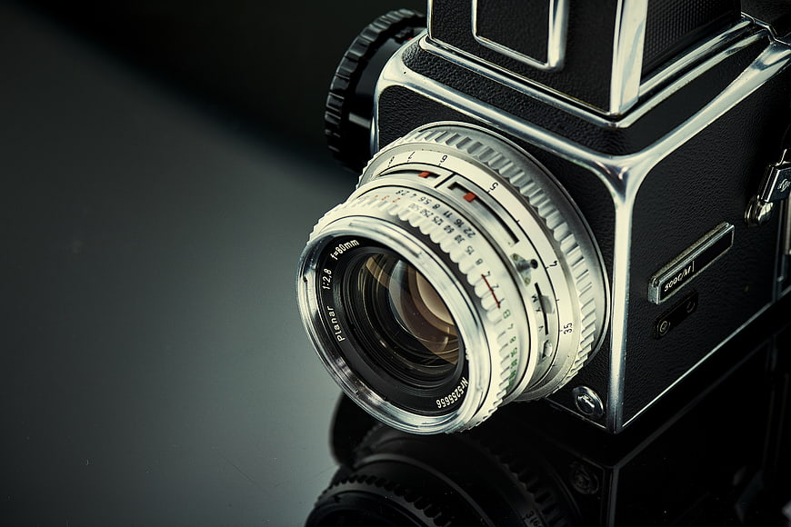 Close-up of vintage Hasselblad camera lens on dark background