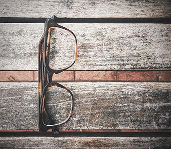 Tortoiseshell Eyeglasses on Rustic Wooden Background