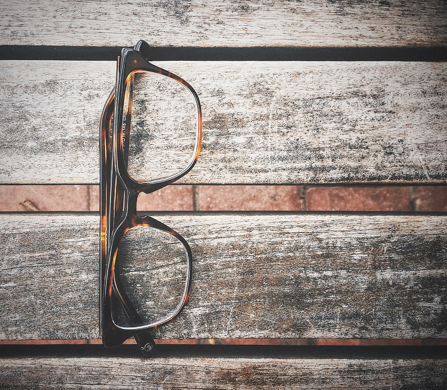 Tortoiseshell Eyeglasses on Rustic Wooden Background