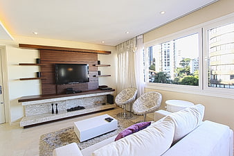 Modern living room interior with white sofa and city view