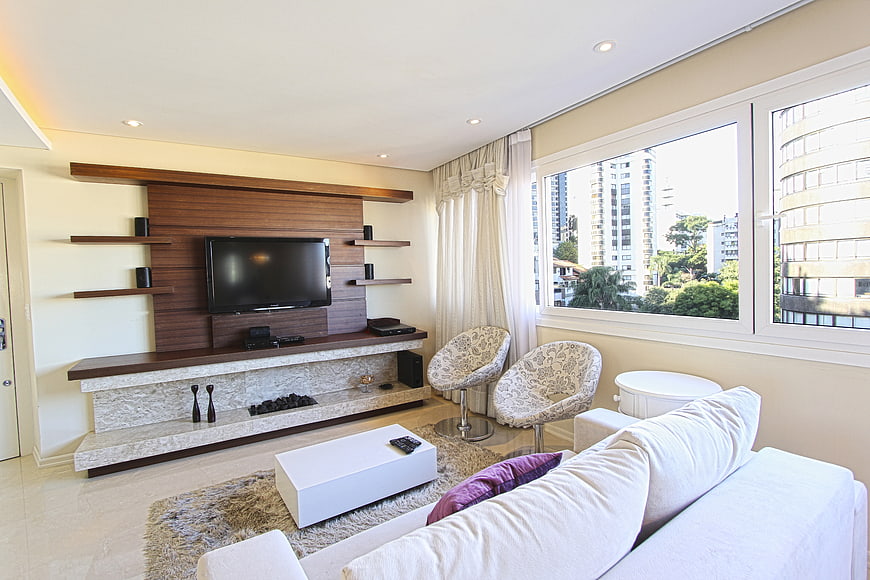 Modern living room interior with white sofa and city view