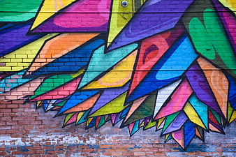 Colorful Graffiti Mural on Brick Wall