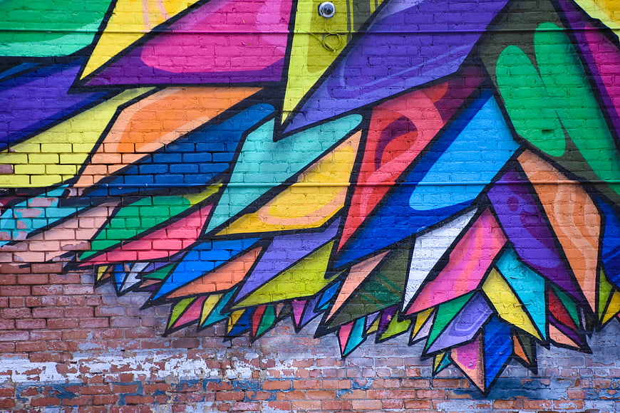 Colorful Graffiti Mural on Brick Wall