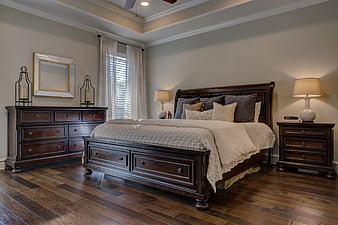 Elegant Master Bedroom with Dark Wood Furniture and Hardwood Floors