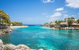 Tropical Lagoon with Turquoise Water and Thatched Beach Cabanas