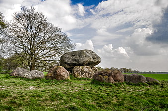 Ancient Dolmen Stone Structure in Green Pasture