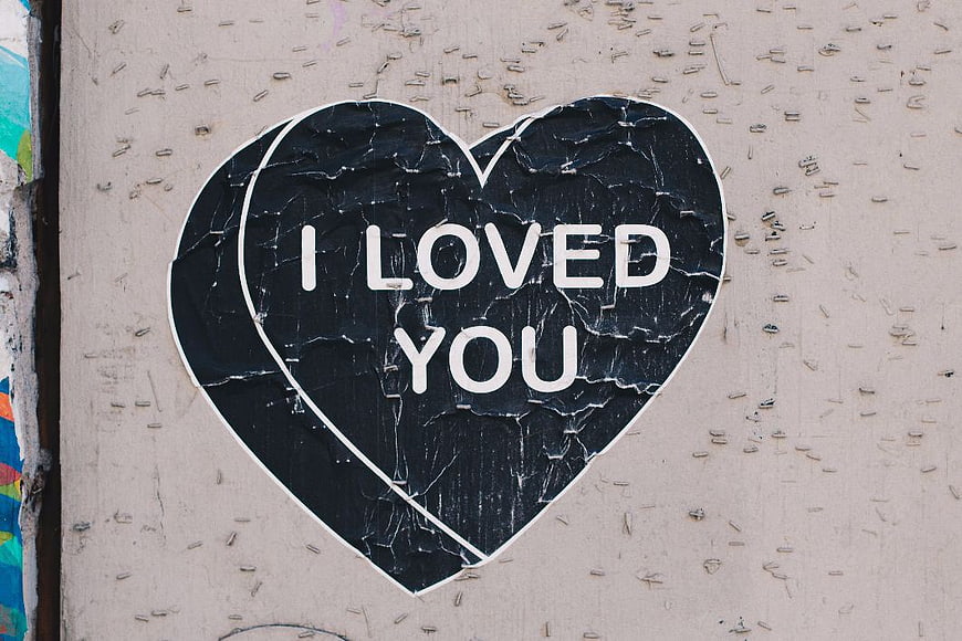 Peeling Heart Sticker with I Loved You Text on Wall