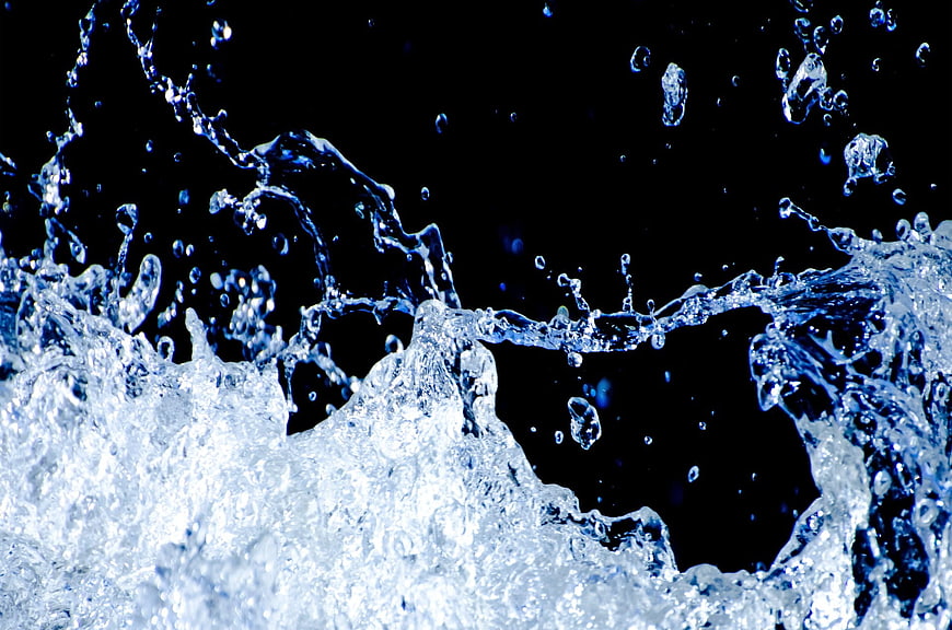 Dynamic Blue Water Splash On Black Background