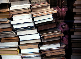 Stacks of old vintage books in a shop window