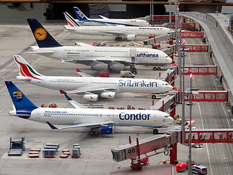 Detailed miniature model airplanes at airport terminal