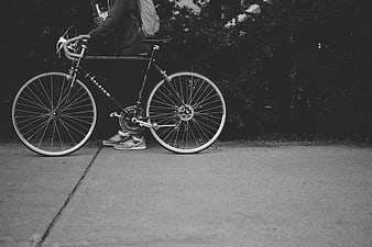 Black and white photo of cyclist with Raleigh bicycle