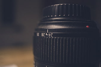 Close-up of black camera lens with zoom markings