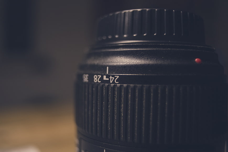 Close-up of black camera lens with zoom markings