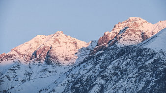 Snow-Capped Mountain Peaks Bathed in Pink Alpenglow