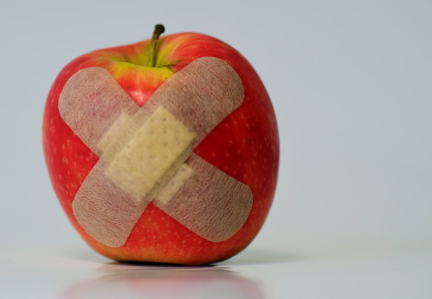 Red Apple with Bandage for Health Concept