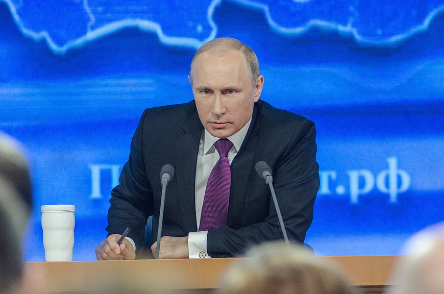 Vladimir Putin speaking at a formal political conference