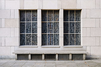 Modernist building facade with geometric stained glass windows