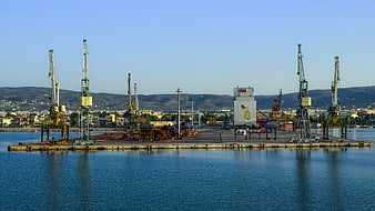 Industrial Port Cranes on a Concrete Pier in Volos, Greece