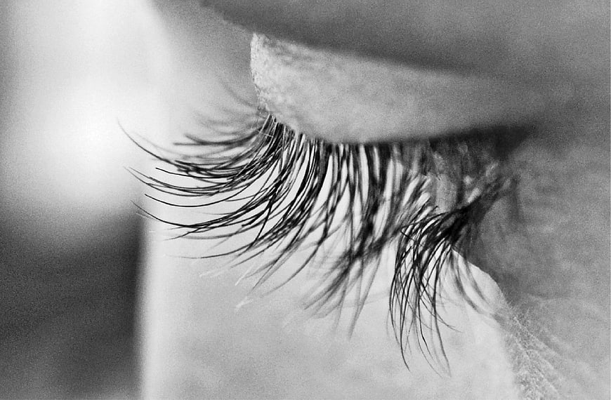 Close-up of eyelashes in black and white