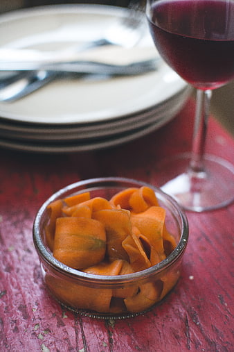 Homemade carrot carpaccio with red wine on rustic table