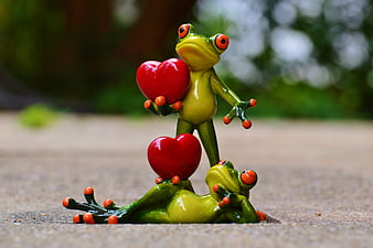 Cute Green Frog Figurines Holding Red Hearts
