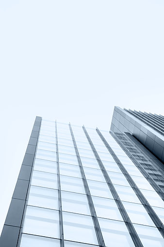 Low angle view of modern glass skyscraper architecture