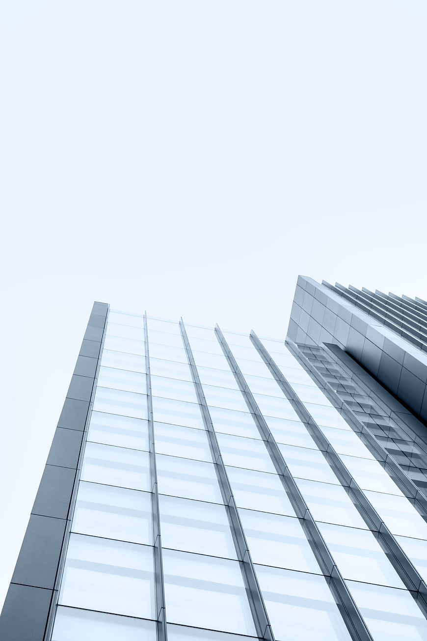 Low angle view of modern glass skyscraper architecture