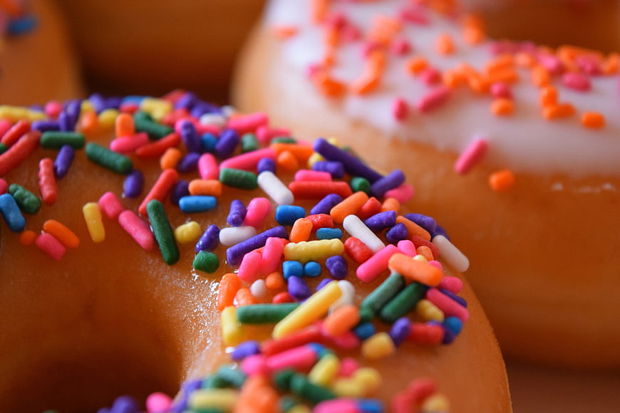 Close-up of Glazed Donuts with Colorful Sprinkles