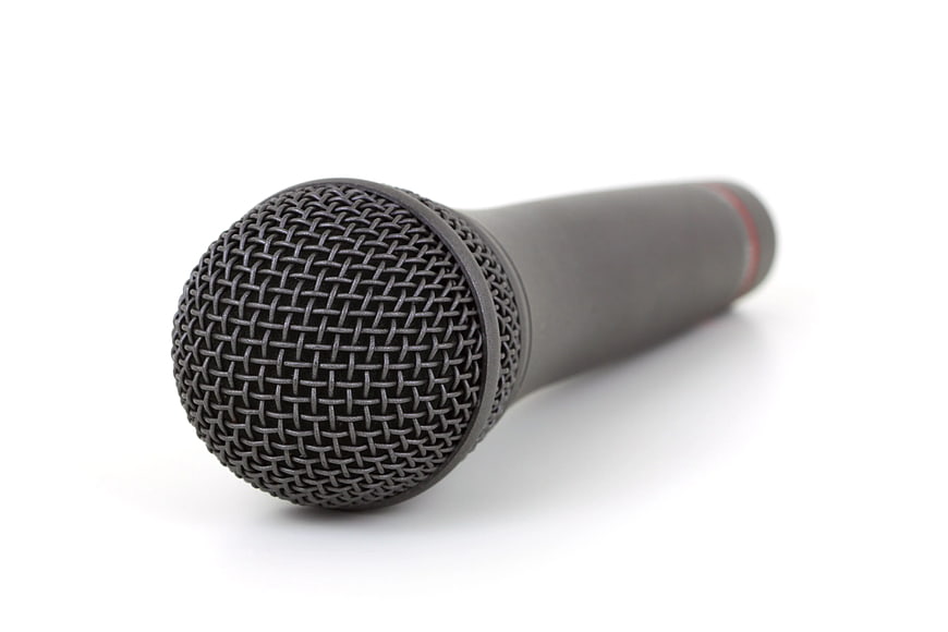 Black handheld microphone on white background