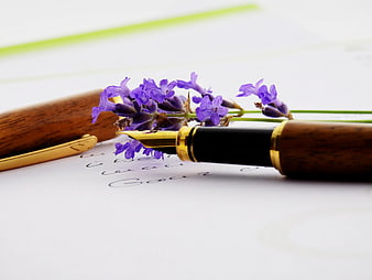 Wooden fountain pen with lavender on handwritten letter