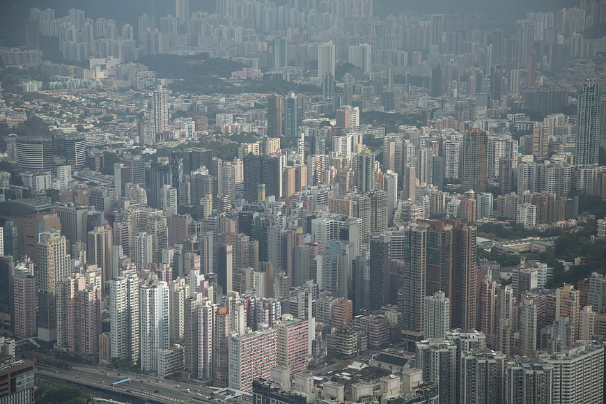 Aerial view of dense urban cityscape with skyscrapers