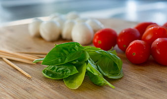 Fresh Caprese Salad Ingredients on Wooden Board