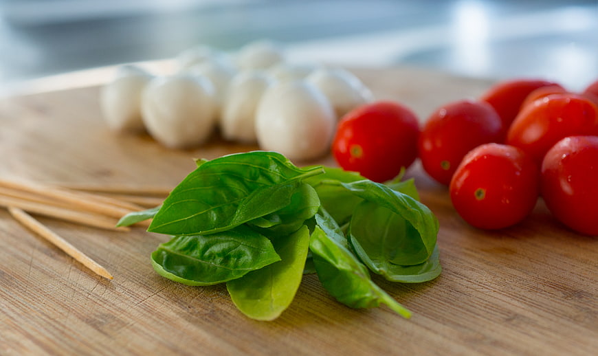 Fresh Caprese Salad Ingredients on Wooden Board