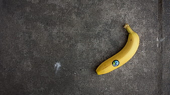 Yellow Banana on Gray Concrete Background