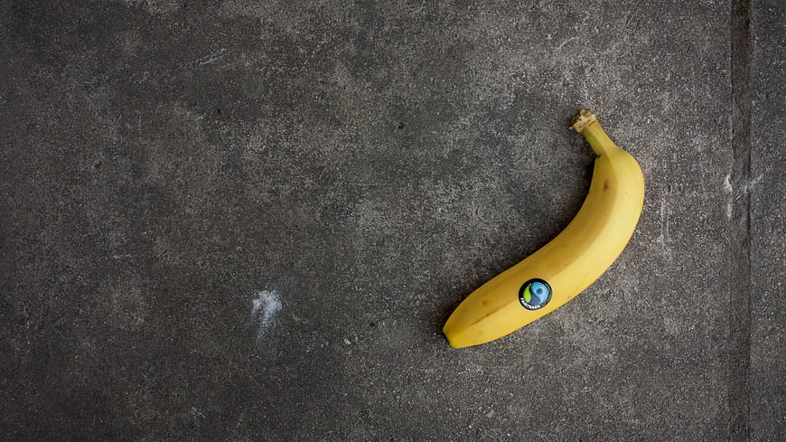 Yellow Banana on Gray Concrete Background