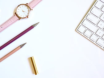 Minimalist Pink Workspace Flat Lay With Watch, Pens, and Keyboard