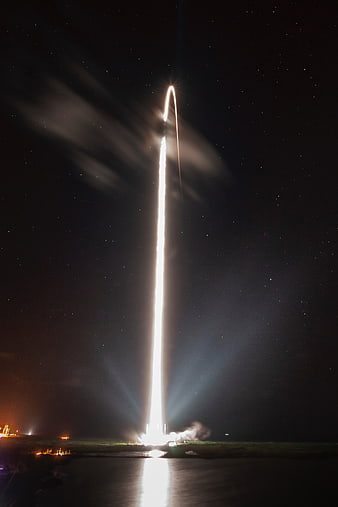 Night Rocket Launch with Starry Sky and Reflection