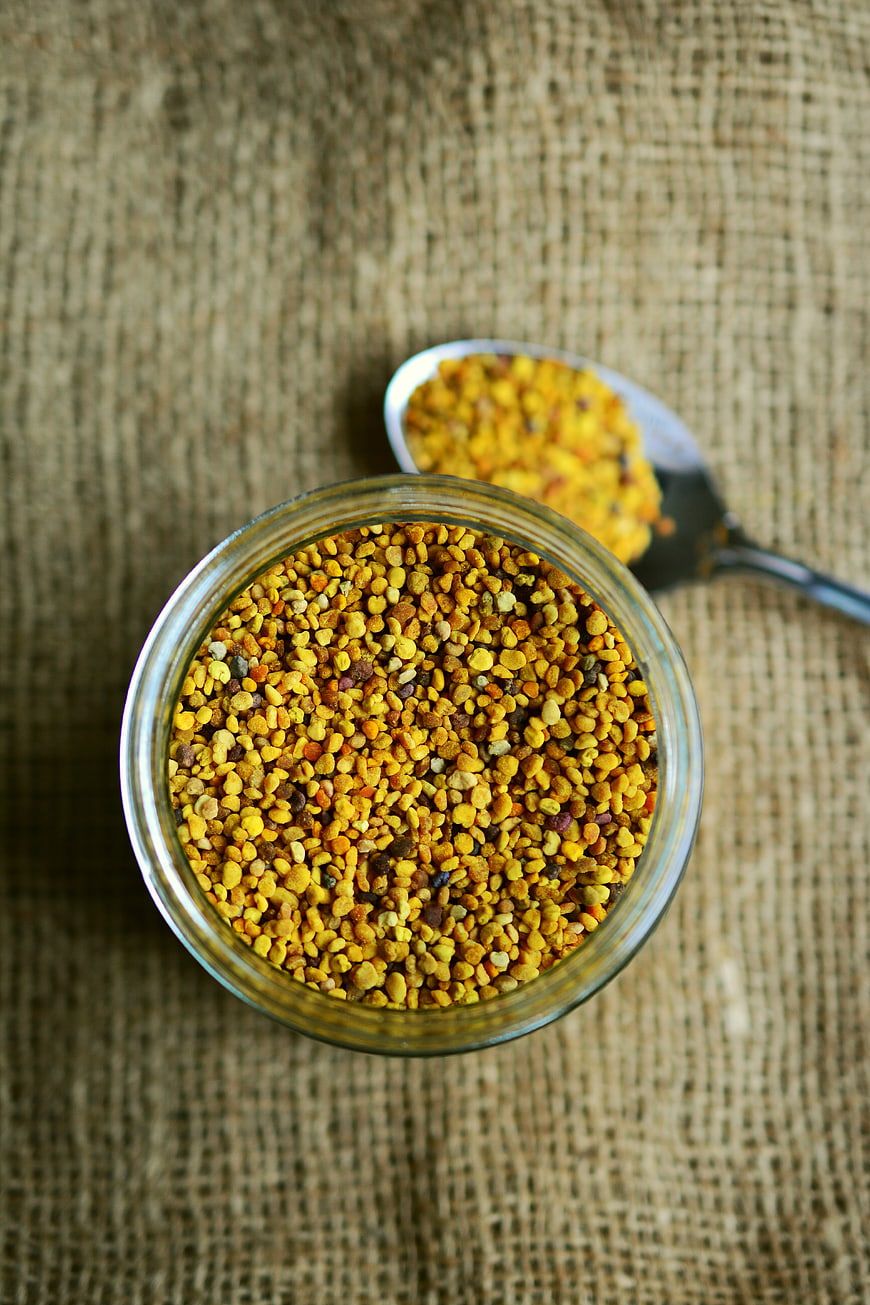 Top View of Bee Pollen in Glass Jar on Burlap
