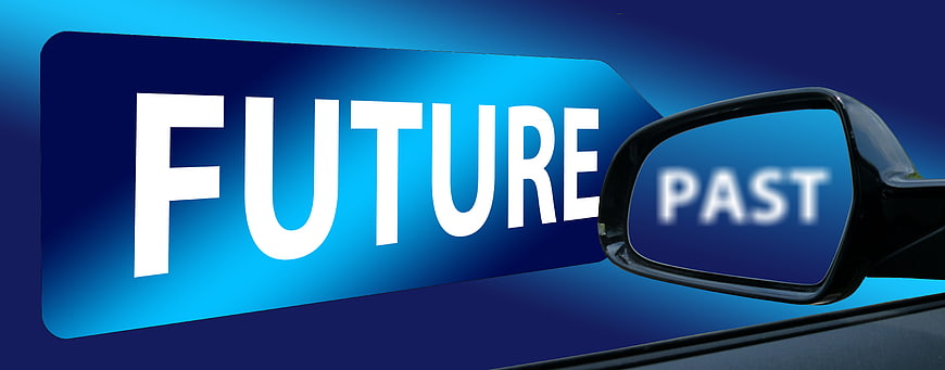 Conceptual car rearview mirror showing past and future text
