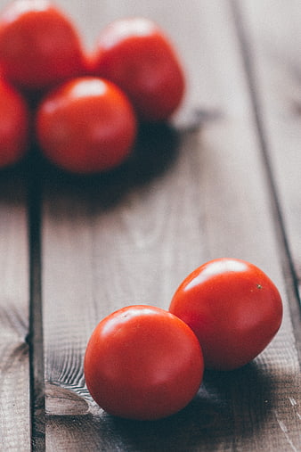 Fresh Red Tomatoes on Rustic Wooden Table