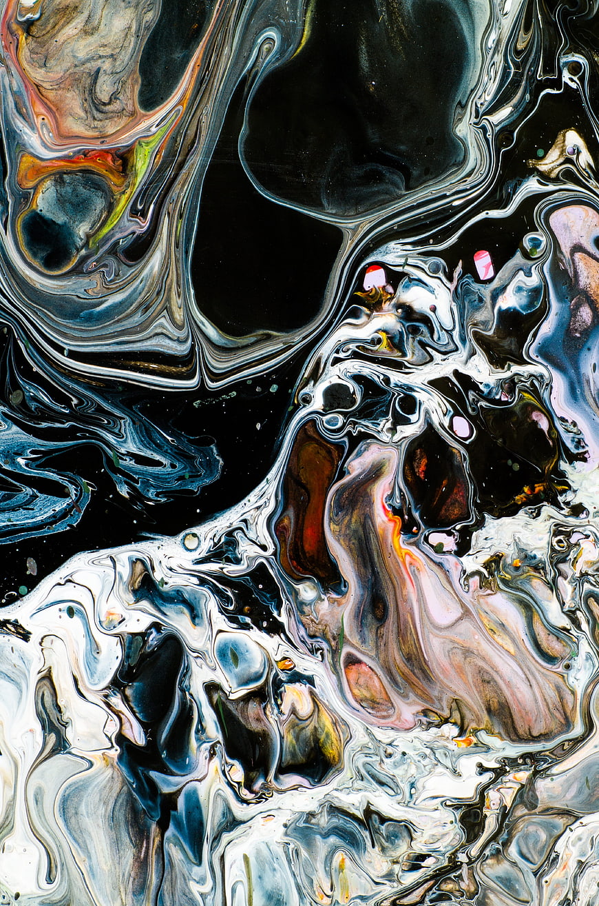 Abstract fluid art with swirling black, white, and metallic colors