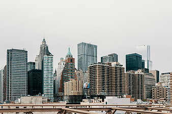 New York City skyline with skyscrapers and bridge railing