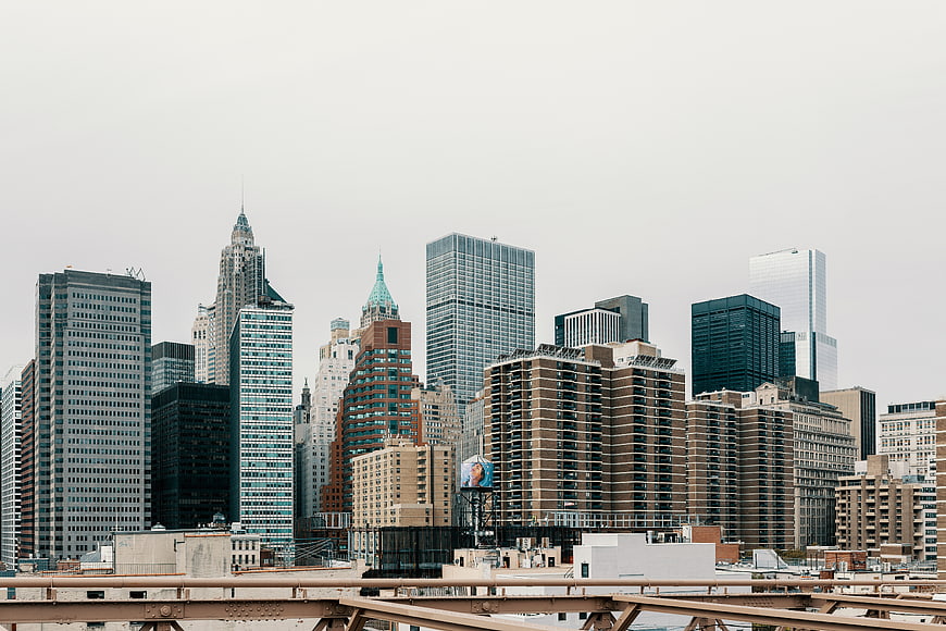 New York City skyline with skyscrapers and bridge railing