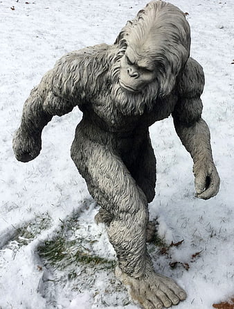 Life-Size Bigfoot Statue Walking in Snowy Yard
