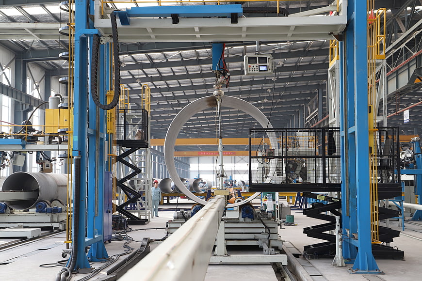 Industrial stainless steel pipe manufacturing plant interior
