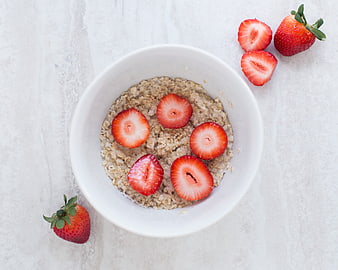 Top View of Oatmeal Bowl with Fresh Sliced Strawberries