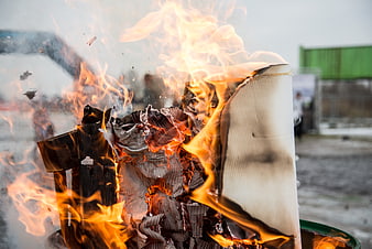 Burning cardboard and paper in a metal fire barrel