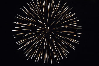 Golden Firework Burst Against Black Night Sky